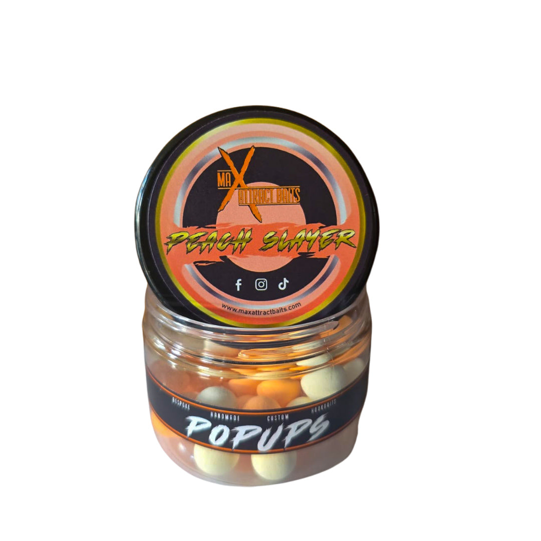 Pot of max attract baits Peach slayer popups set in white back ground