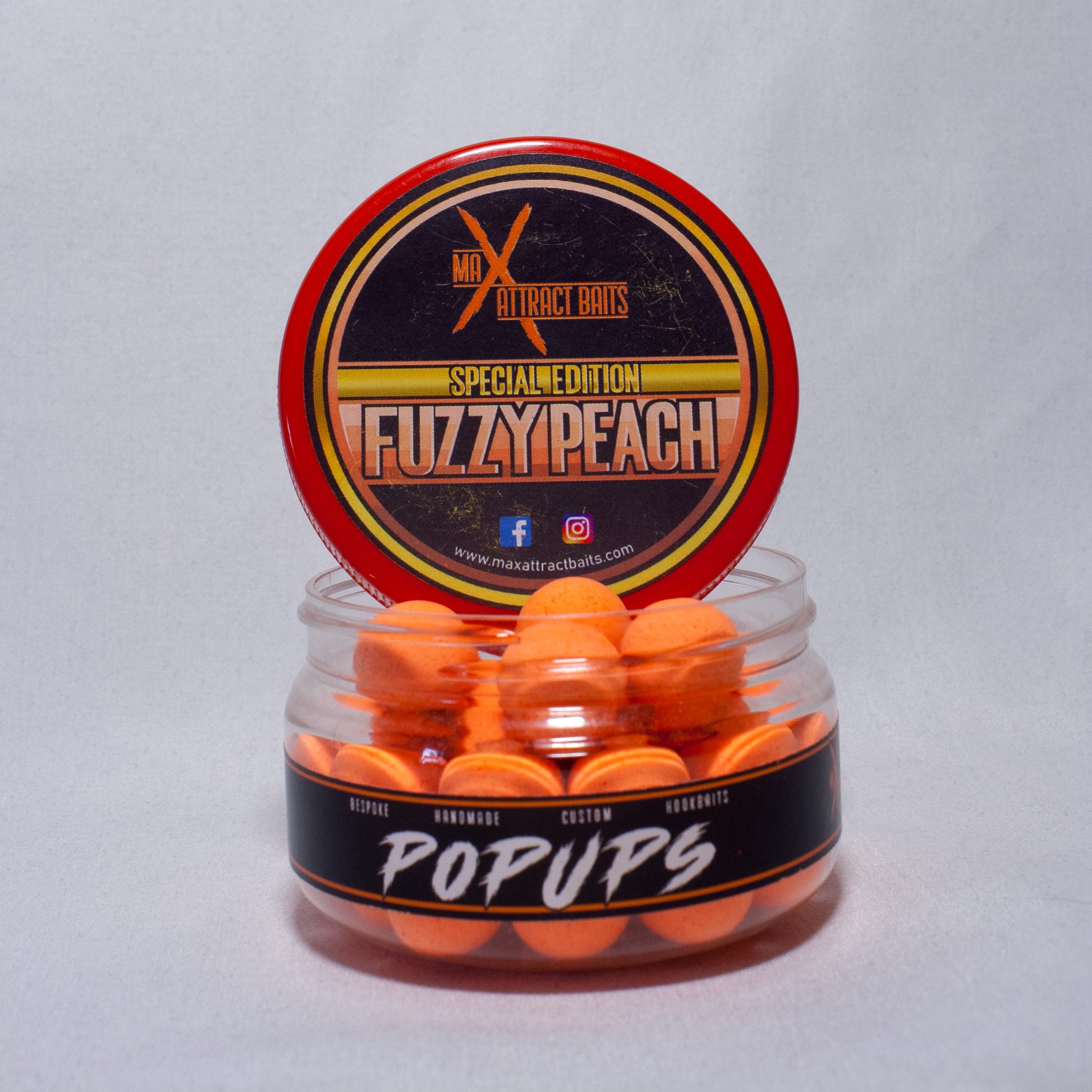 Pot of max attract baits Fuzzy Peach orange popups set in white back ground