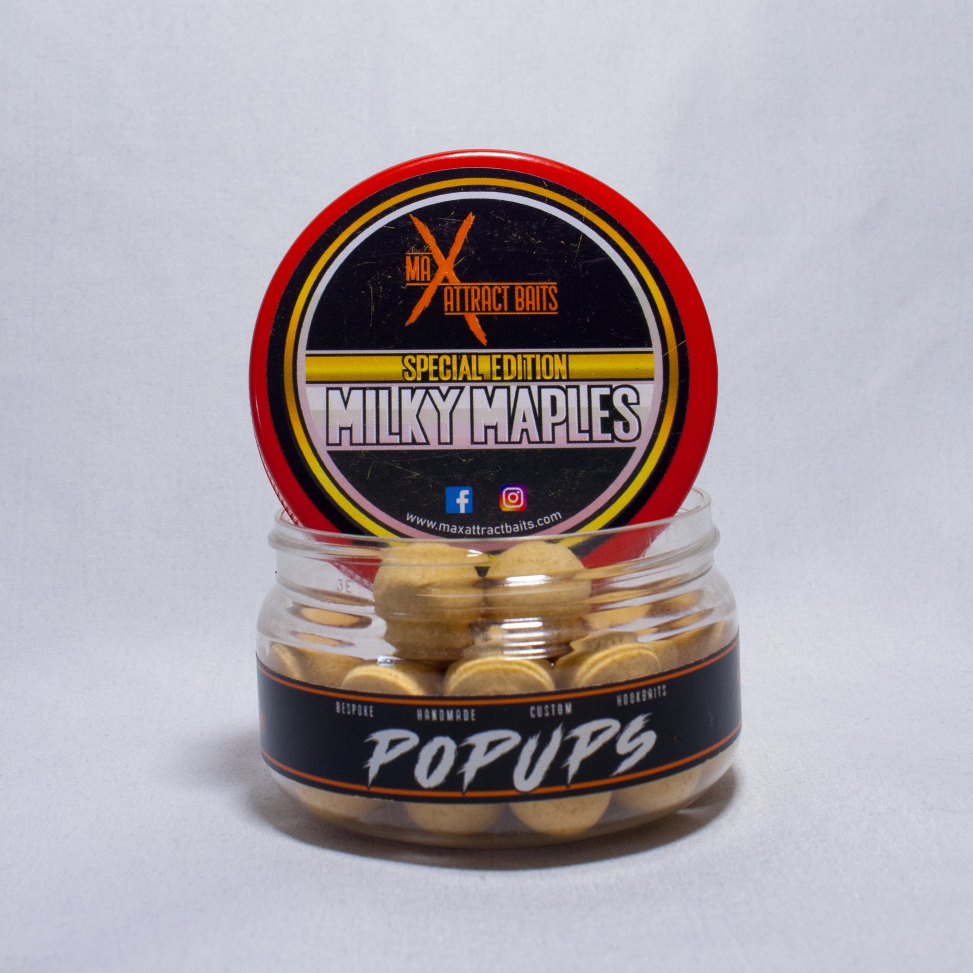 Pot of max attract baits Milky Maple popups set in white back ground