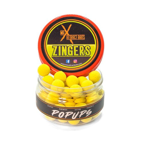 Pot of max attract baits zingers 15mm popups set in white back ground